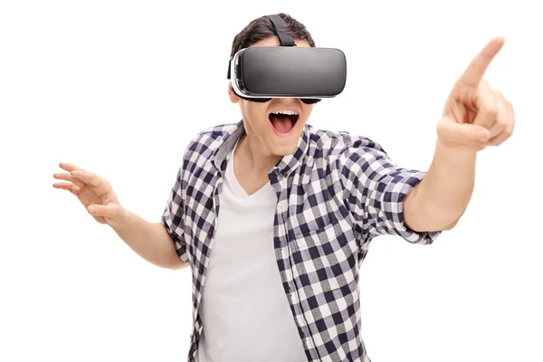 Excited young man using a VR headset — Stock Photo, Image