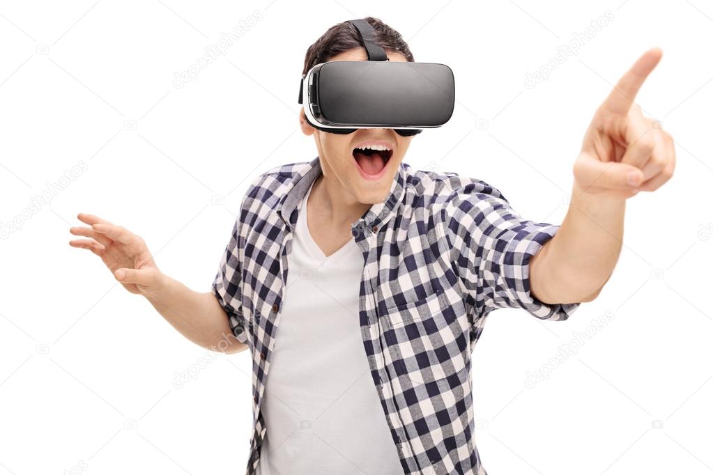 Excited young man using a VR headset 
