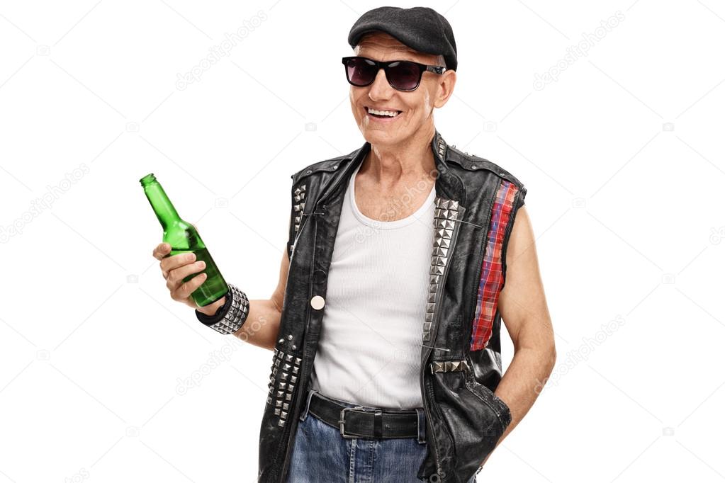 Senior punk rocker holding a beer 