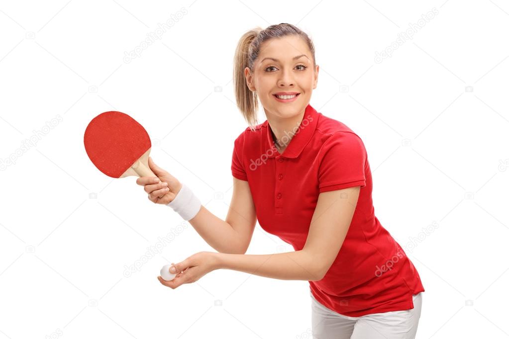 Joyful woman playing table tennis 