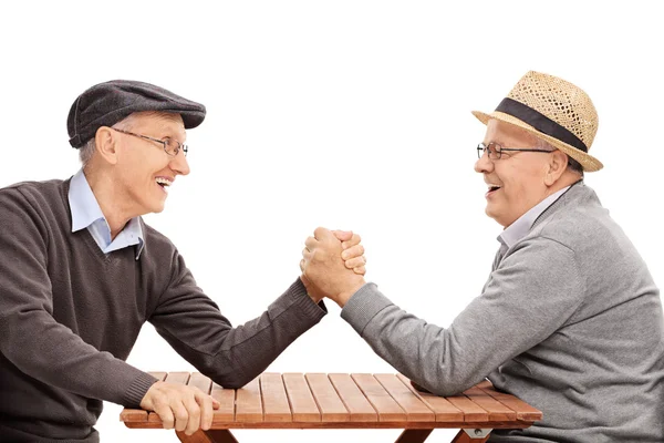 Senior men having an arm wrestle competition — Stock Photo, Image