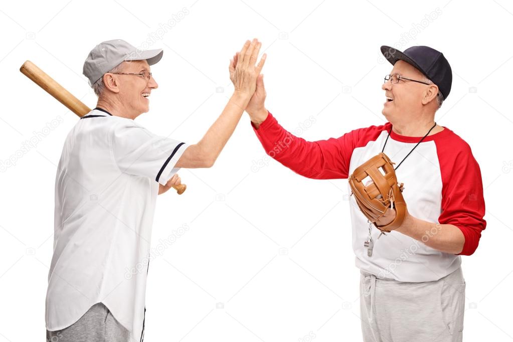 Senior men high-five each other