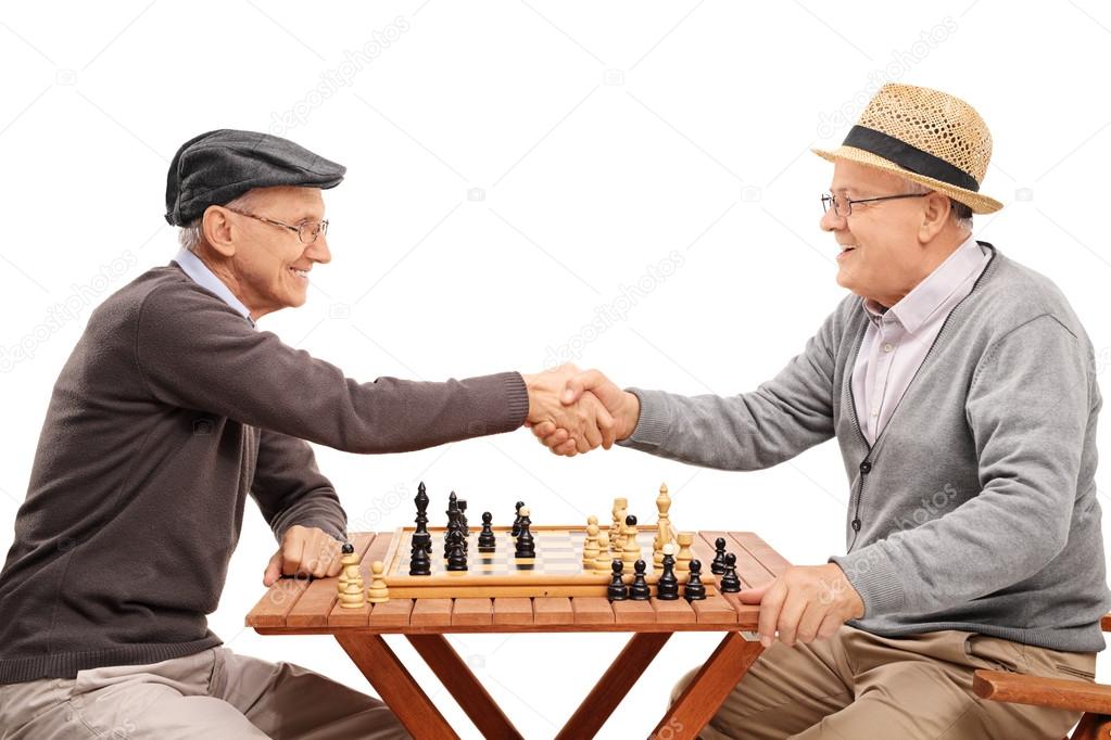 senior gentlemen shaking hands after a game