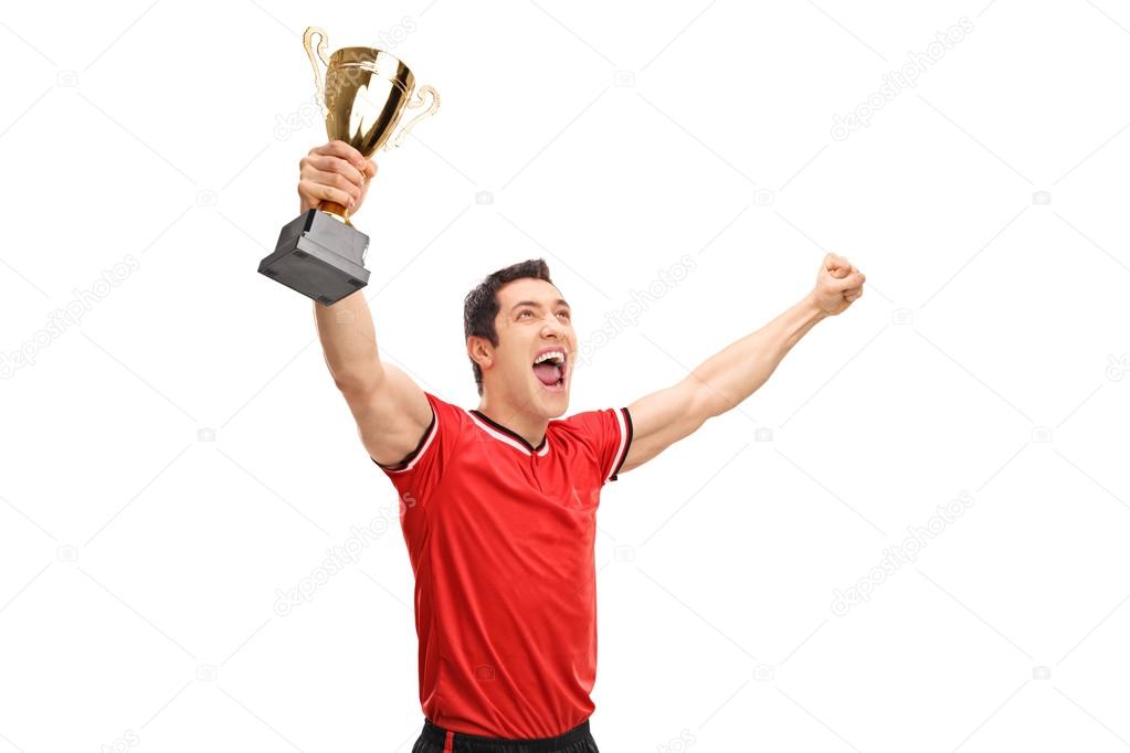Sportsman holding a trophy and celebrating  
