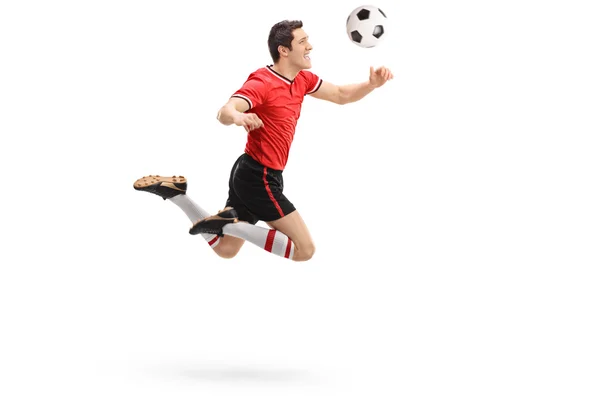 Bir top başlık futbolcu — Stok fotoğraf