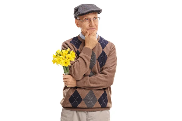 Senior gentleman holding a bunch of flowers — Stock Photo, Image
