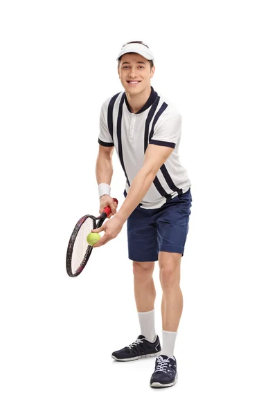 Young tennis player preparing for a serve — Stock Photo, Image