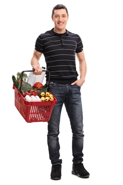 Young man carrying groceries — Stock Photo, Image