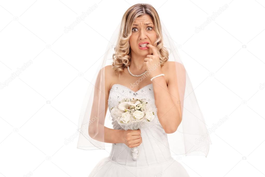 Nervous bride biting her nails