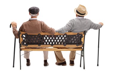 bir bankta oturan üst düzey beyler