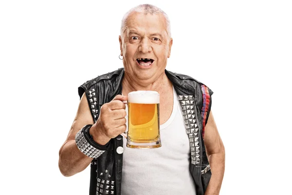 Mature punk rocker holding a pint of beer — Stock Photo, Image