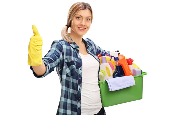 Cheerful girl holding cleaning products — Stock Photo, Image