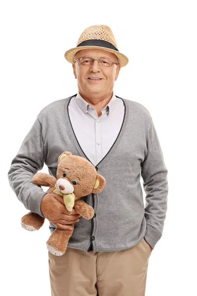 Senior herre håller en nallebjörn — Stockfoto