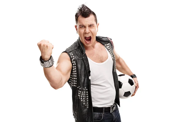 Football hooligan holding a ball and shouting — Stock Photo, Image