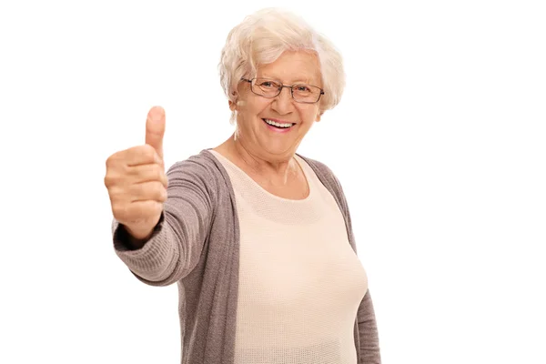 Elderly woman giving a thumb up — Stock Photo, Image