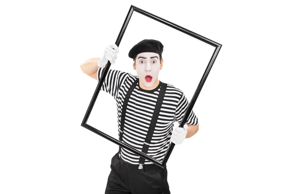 Mime artist performing with a picture frame — Stock Photo, Image