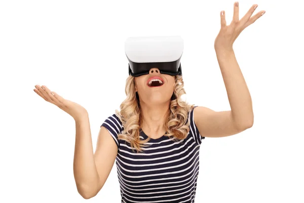 Amazed woman looking in a VR goggles — Stock Photo, Image