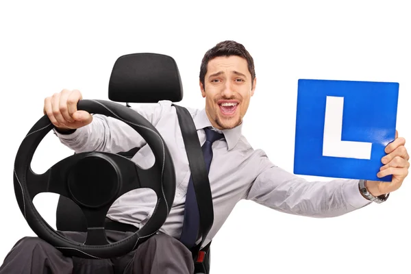 Confident young driver holding an L sign — Stock Photo, Image