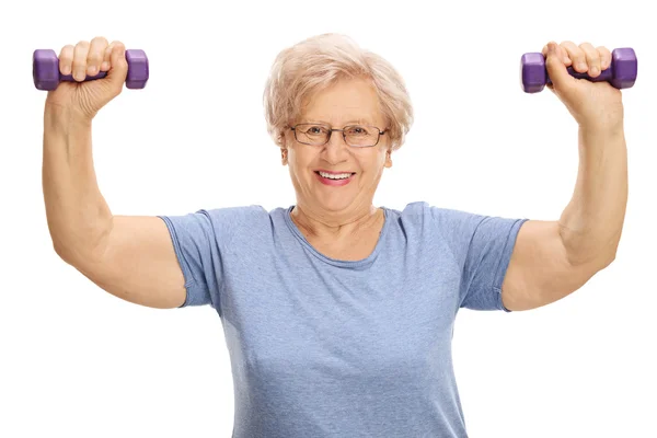 Mature woman exercising with dumbbells — Stock Photo, Image