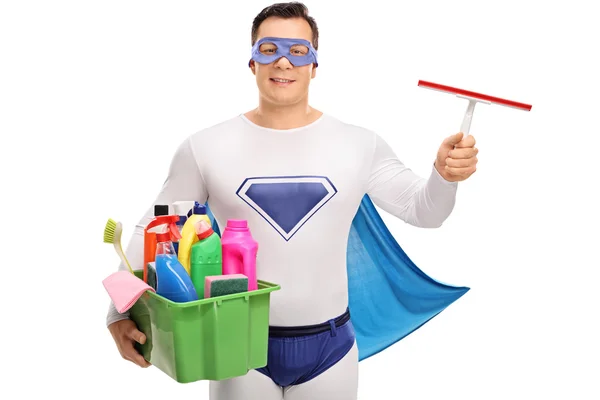 Superherói segurando equipamento de limpeza — Fotografia de Stock