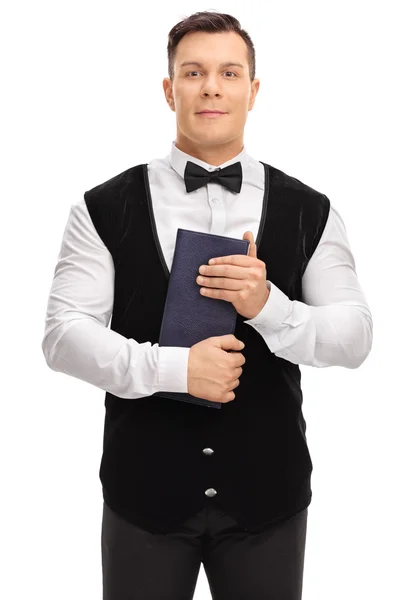 Young waiter holding a menu — Stock Photo, Image