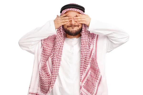 Jonge Arabische man die betrekking hebben op zijn ogen — Stockfoto