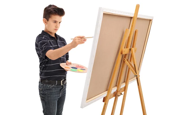 Pequeño niño pintando sobre un lienzo — Foto de Stock