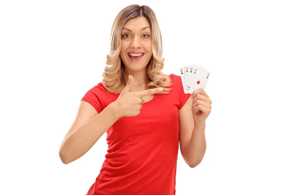 Joyful woman holding four aces — Stock Photo, Image