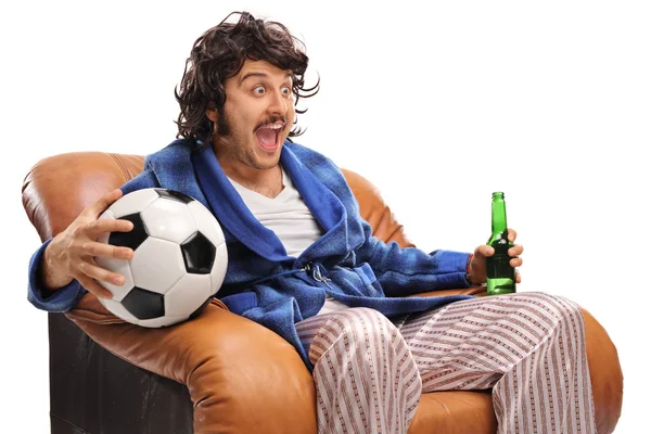 Ecstatic football fan watching a game on TV — Stock Photo, Image