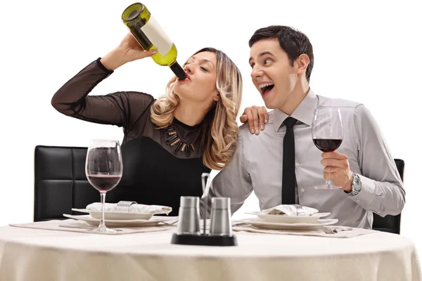 Couple drinking wine from a bottle — Stock Photo, Image