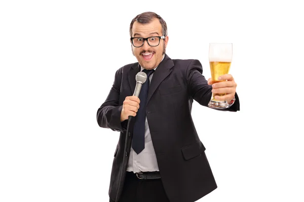 Businessman with beer singing karaoke — Stock Photo, Image