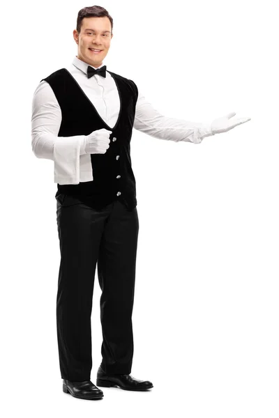 Friendly waiter greeting someone — Stock Photo, Image