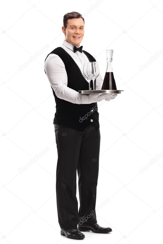 Waiter carrying a tray with wine Stock Photo by ©ljsphotography 114847104