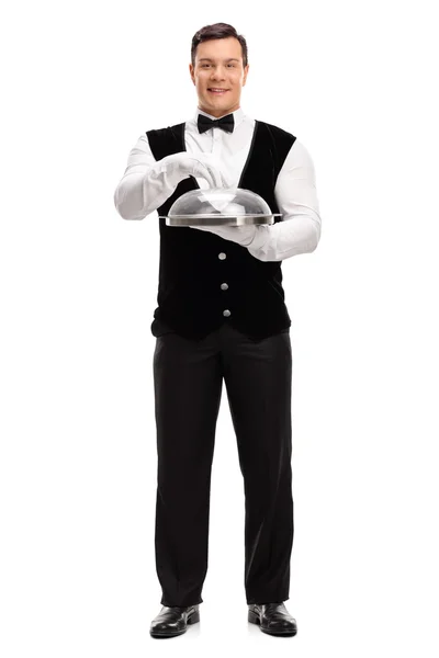 Waiter holding a tray with plastic lid — Stock Photo, Image