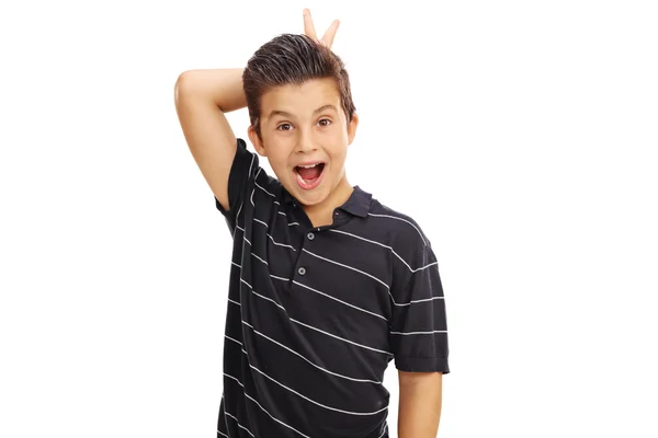 Kid making bunny ears on himself — Stock Photo, Image