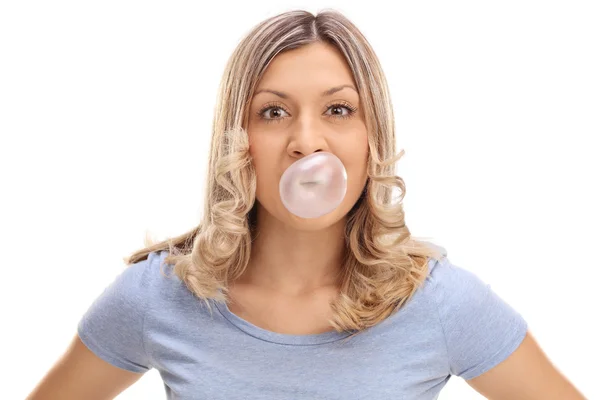 Woman blowing a bubble from a gum — Stock Photo, Image