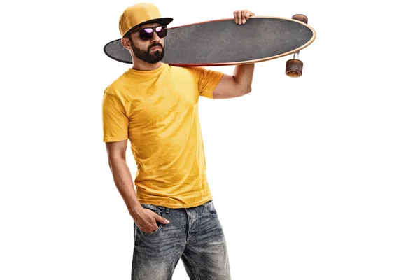 Cool guy holding a longboard — Stock Photo, Image