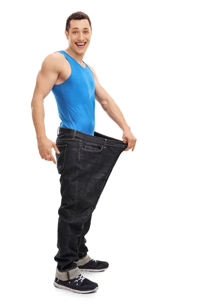 Guy in an oversized pair of jeans — Stock Photo, Image