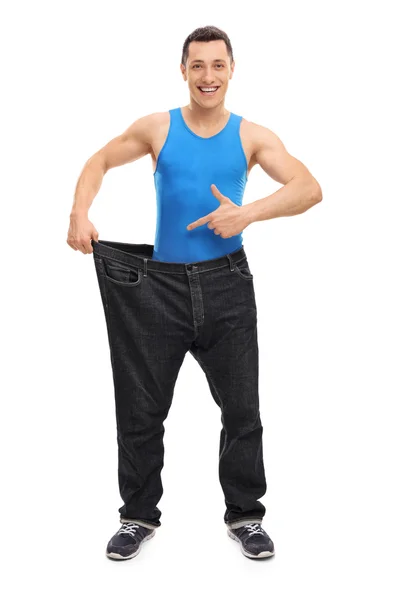 Man in old pair of oversized jeans — Stock Photo, Image