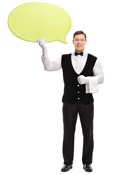 Male waiter holding a speech bubble — Stock Photo, Image