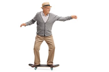 Joyful senior man riding a skateboard  clipart