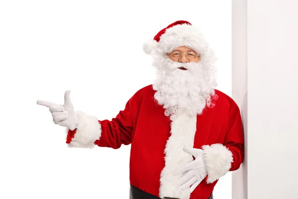 Santa Claus pekar till vänster — Stockfoto