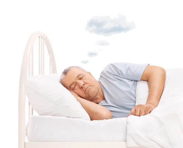 Senior man dromen met wolk boven het hoofd — Stockfoto