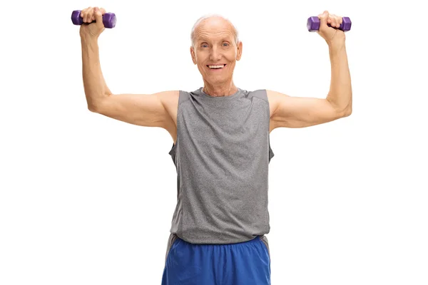 Senior man exercising with dumbbells — Stock Photo, Image