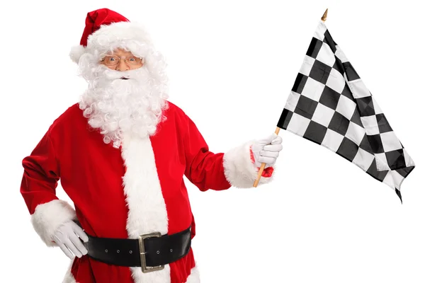 Papai Noel acenando uma bandeira de corrida — Fotografia de Stock