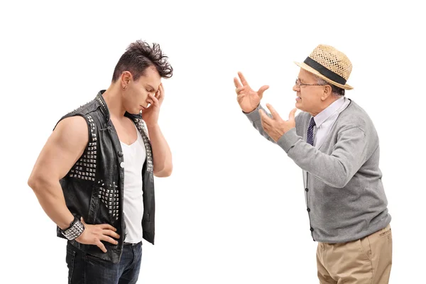 Punker having an argument with a senior man — Stock Photo, Image