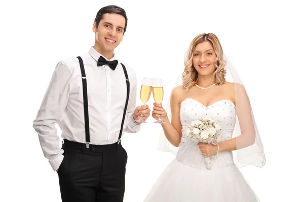 Young bride and groom making a toast — Stock Photo, Image