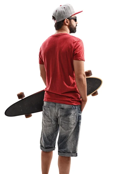 Sakallı adam bir longboard holding — Stok fotoğraf