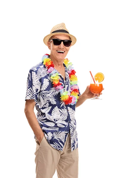 Senior tourist holding a cocktail — Stock Photo, Image
