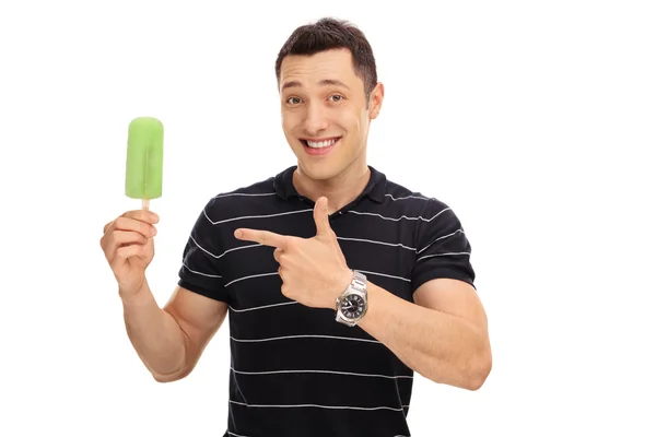 Smiling guy holding an ice cream — Stock Photo, Image